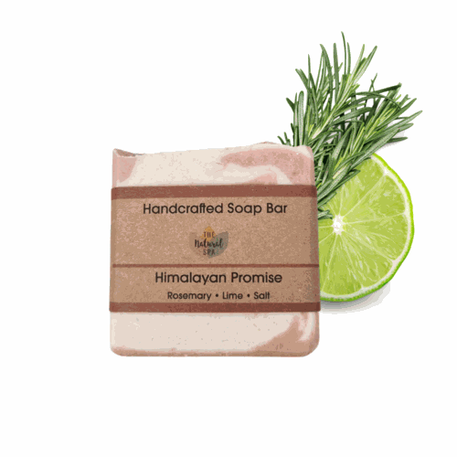 Handcrafted Natural Spa Himalayan Promise Soap Bar with lime and rosemary essence, featuring gentle exfoliation properties, displayed with rosemary sprigs.