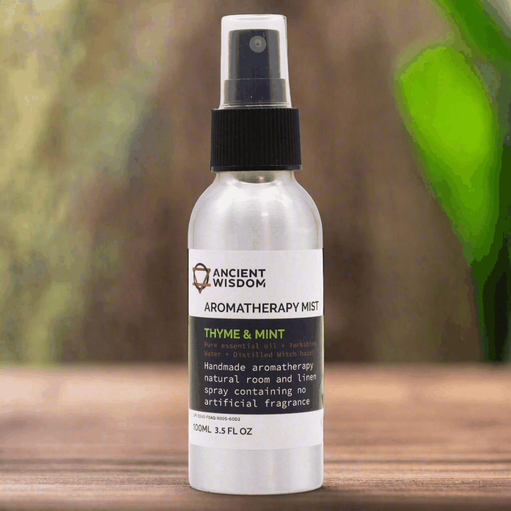 100ml Essential Oil Mist with Thyme and Mint on wooden surface, offering clarity and calm.