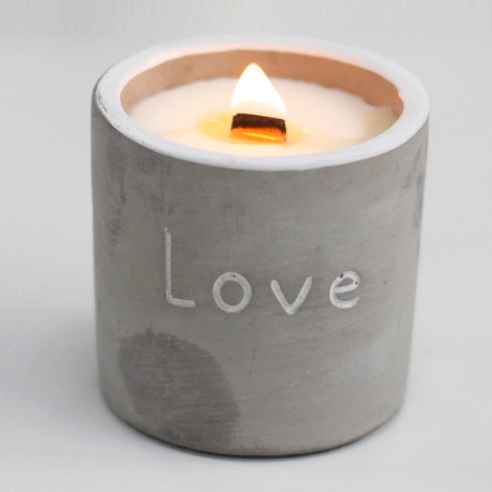 Medium concrete pot candle with wooden wick, engraved with "Love", handcrafted in a concrete vessel, purple fig & casis scent.