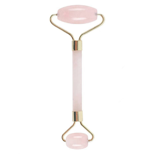 Rose quartz gemstone face roller for skincare and relaxation.