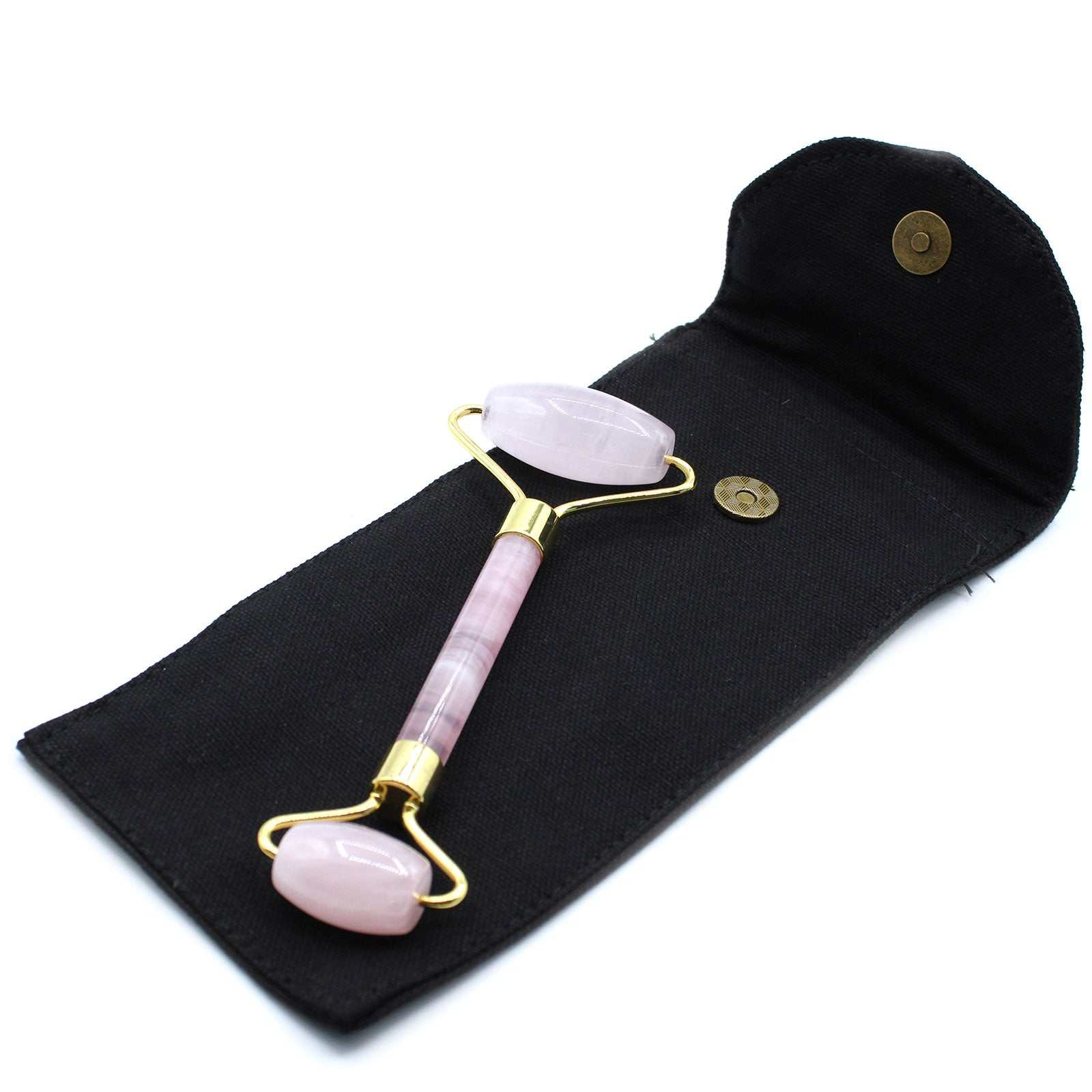 Rose quartz gemstone face roller for skincare and relaxation.