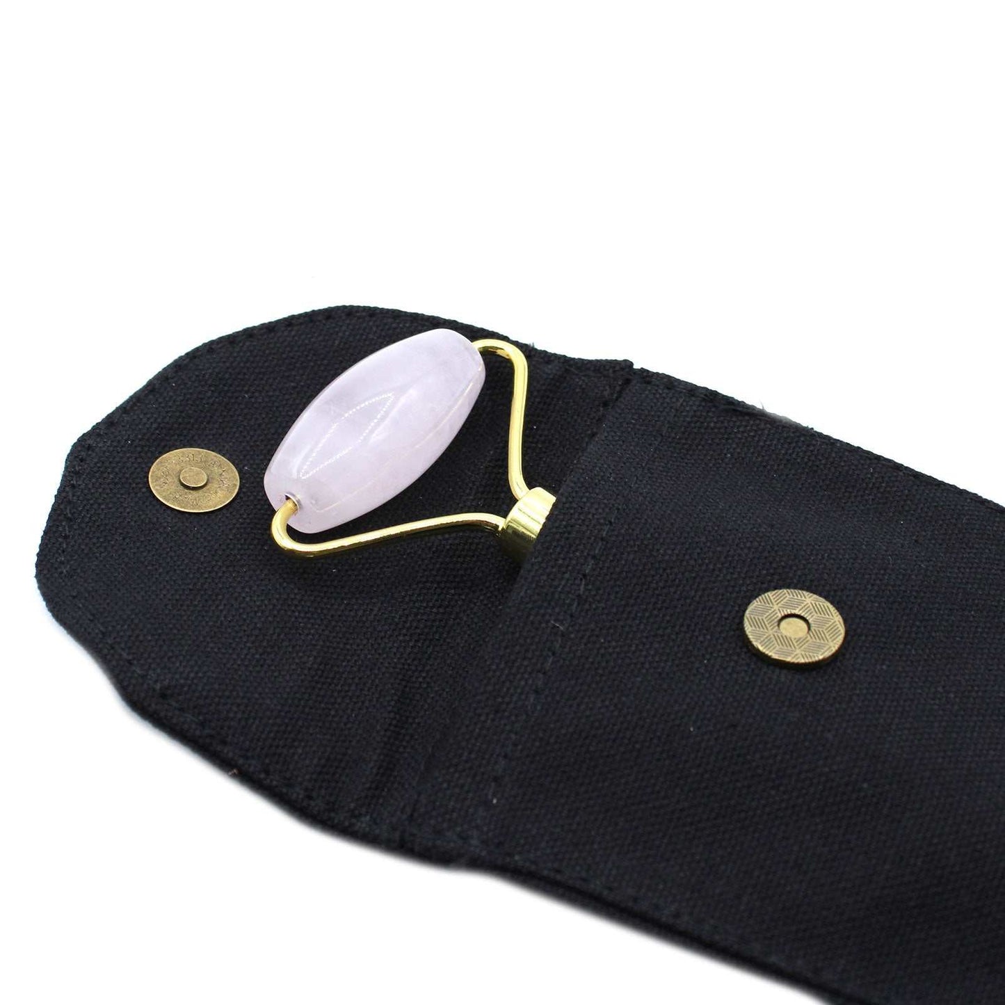 Rose quartz gemstone face roller for skincare and relaxation.