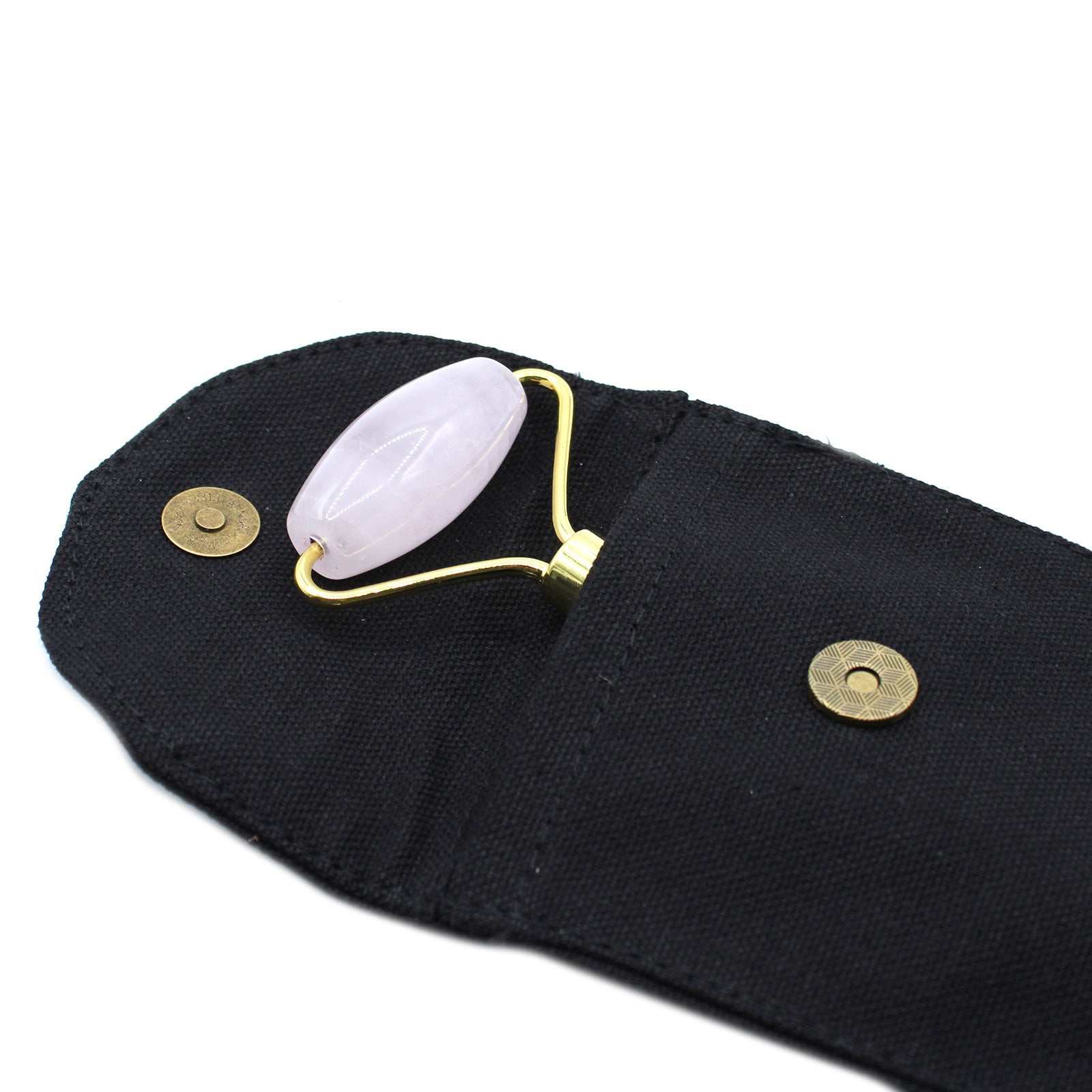 Rose quartz gemstone face roller for skincare and relaxation.
