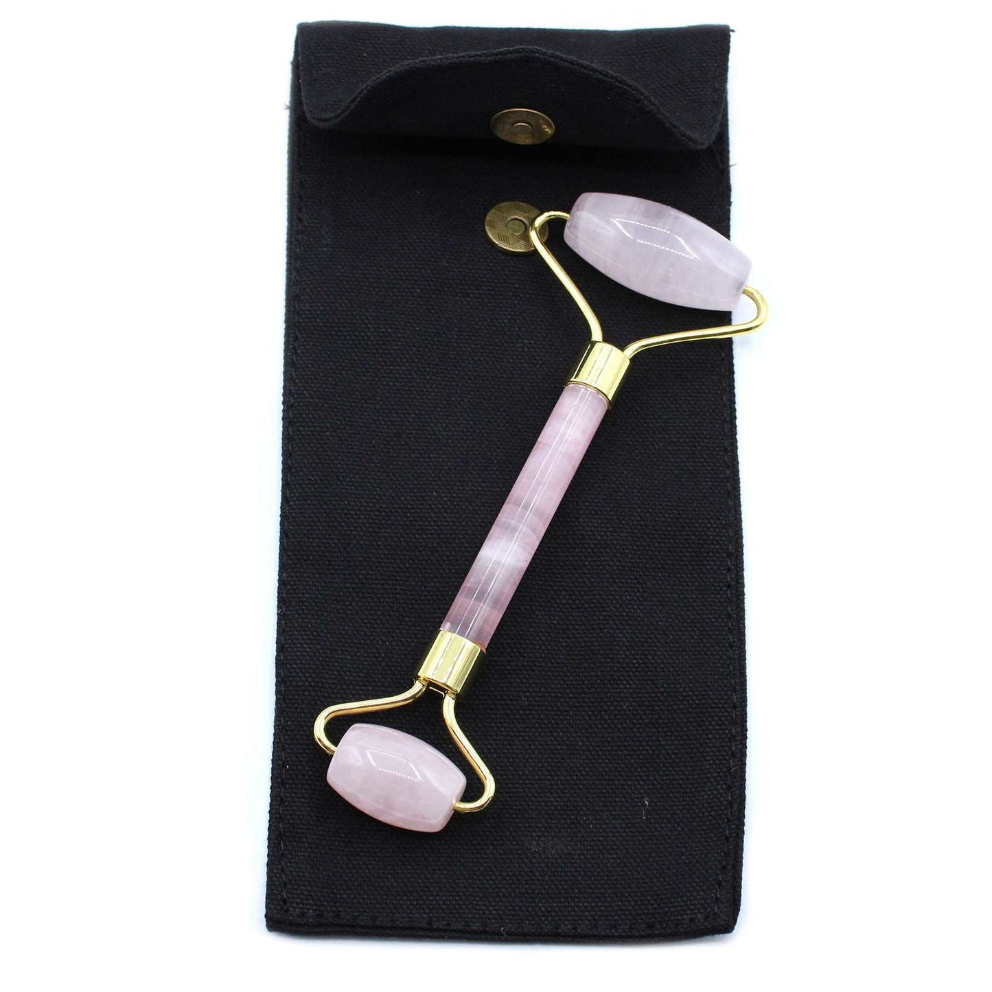 Rose quartz gemstone face roller for skincare and relaxation.