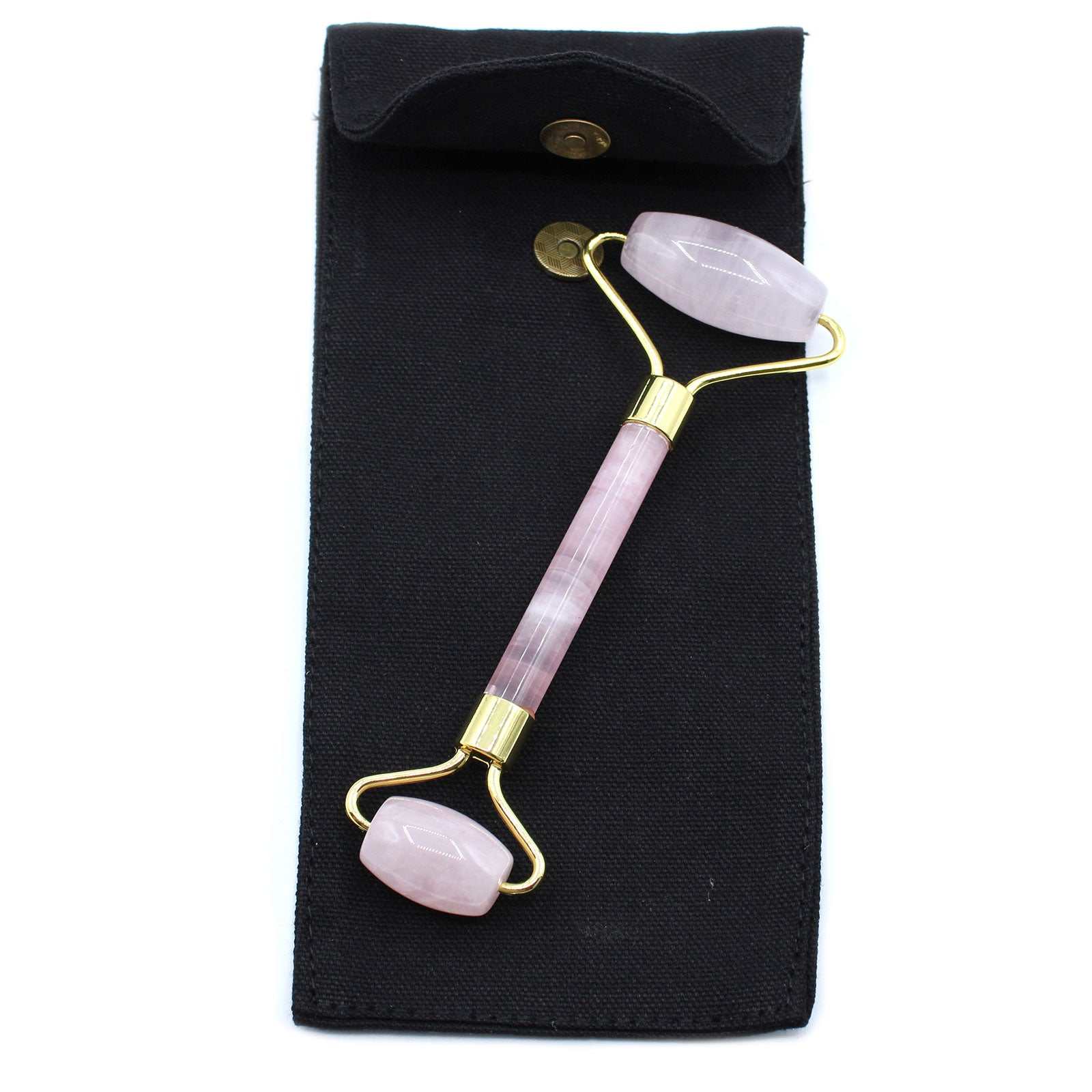Rose quartz gemstone face roller for skincare and relaxation.