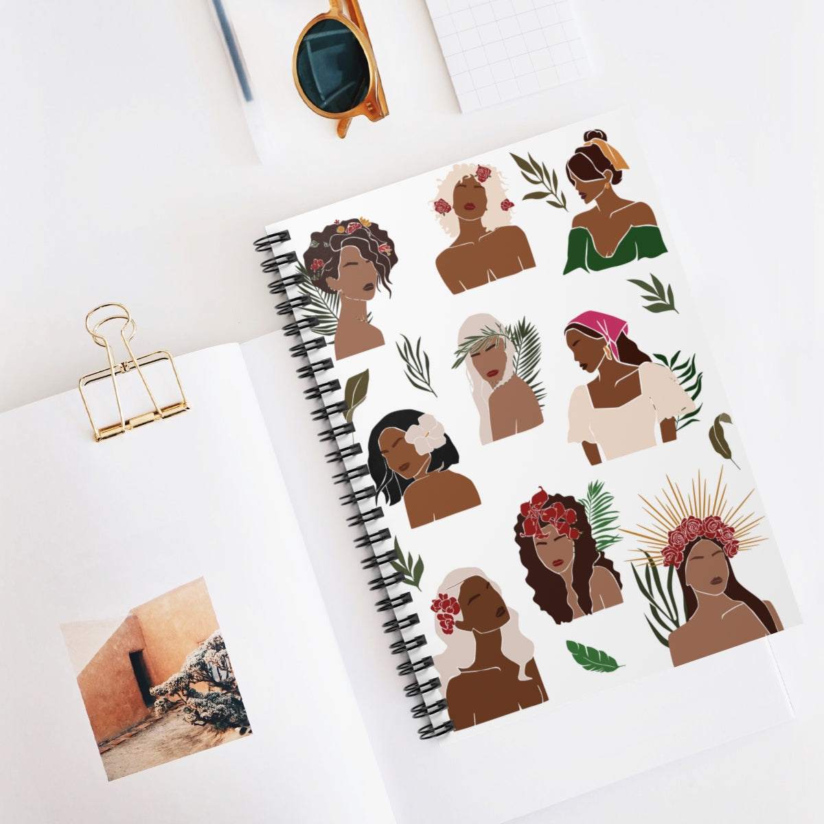 A5 spiral notebook with illustrations celebrating women and nature, featuring lined pages.