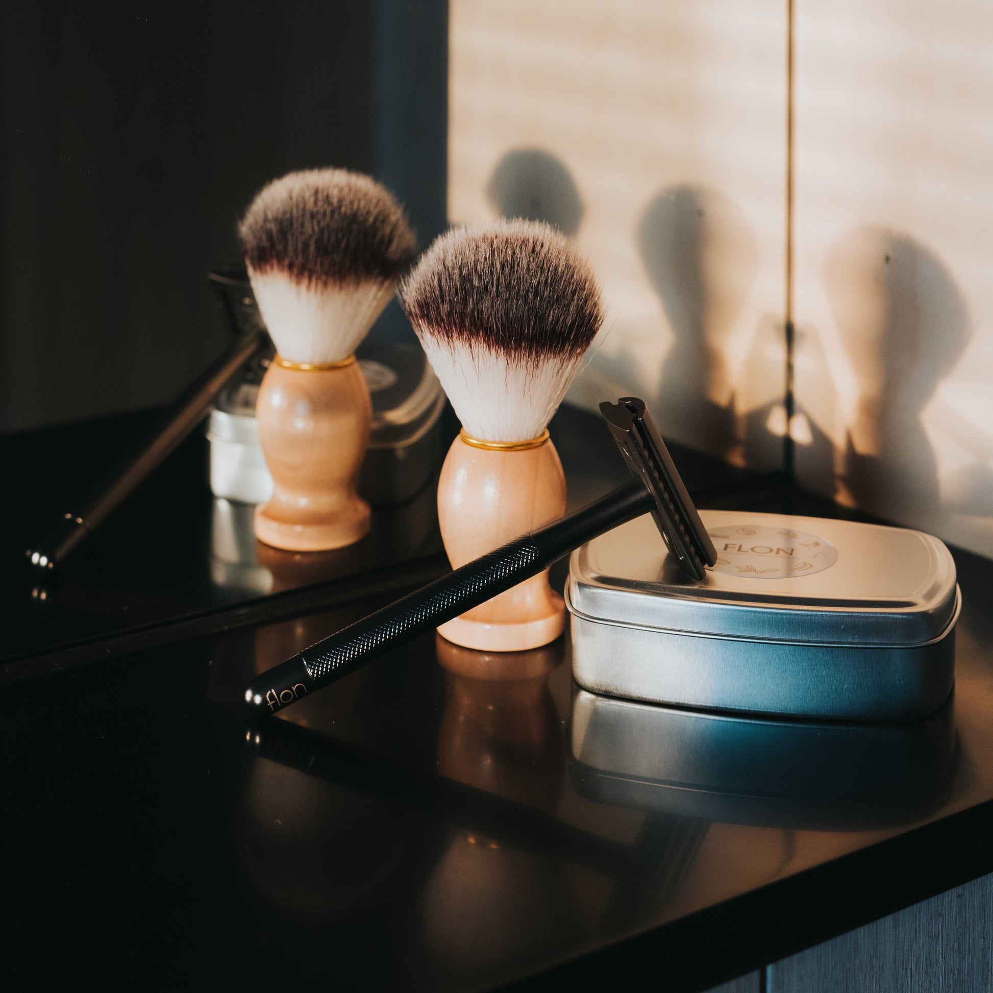 Single 2.0 Safety Razor with longer handle and unisex design on bathroom counter.
