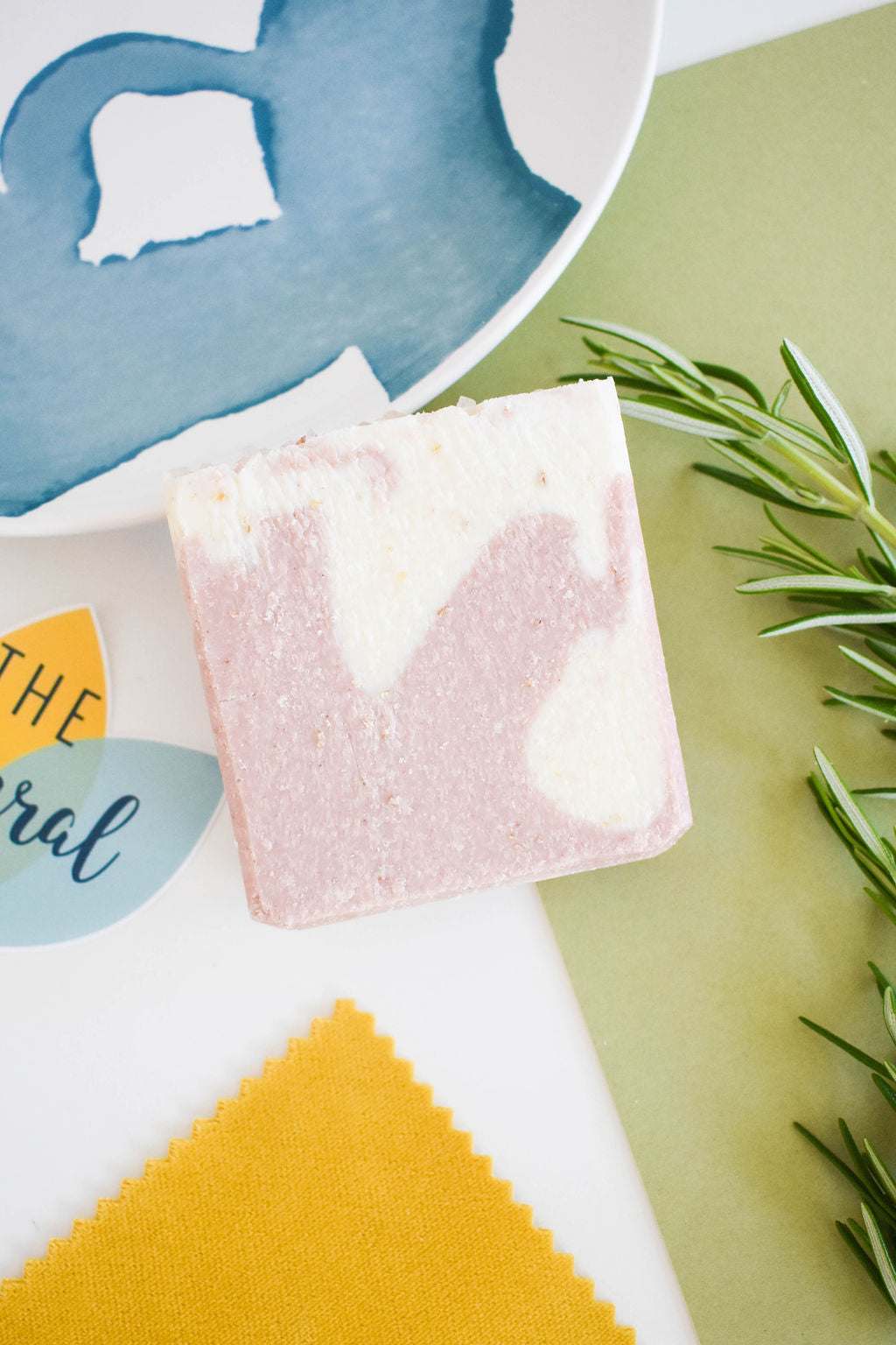 Himalayan Promise Soap BarHandcrafted Natural Spa Himalayan Promise Soap Bar with lime and rosemary essence, featuring gentle exfoliation properties, displayed with rosemary sprigs.