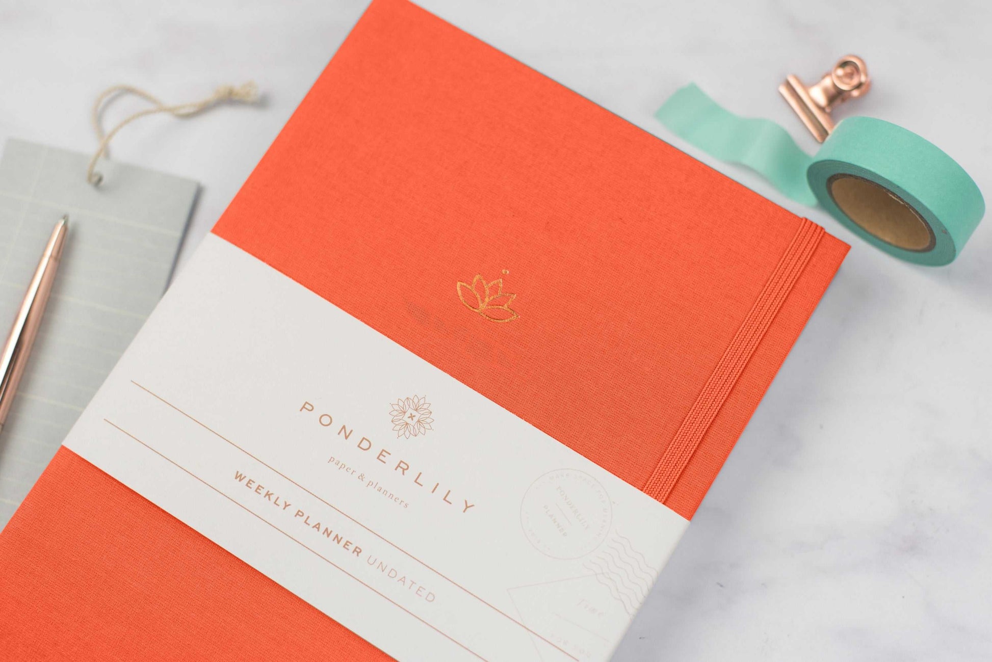 Undated Weekly Ponderlily Planner in Cayenne with eco-conscious design and elegant finish.