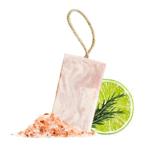 Handcrafted Natural Spa Himalayan Promise Soap Bar with lime and rosemary essence, featuring gentle exfoliation properties, displayed with rosemary sprigs.